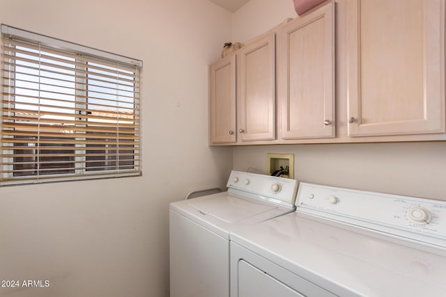 washroom with cabinets and independent washer and dryer