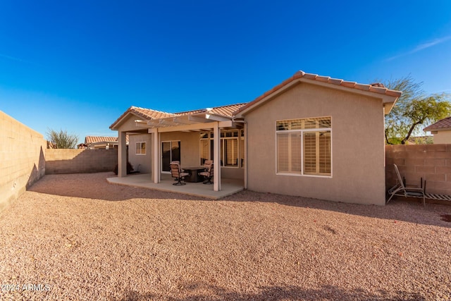 back of house with a patio area