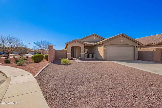 view of front of property with a garage, concrete driveway, fence, and stucco siding