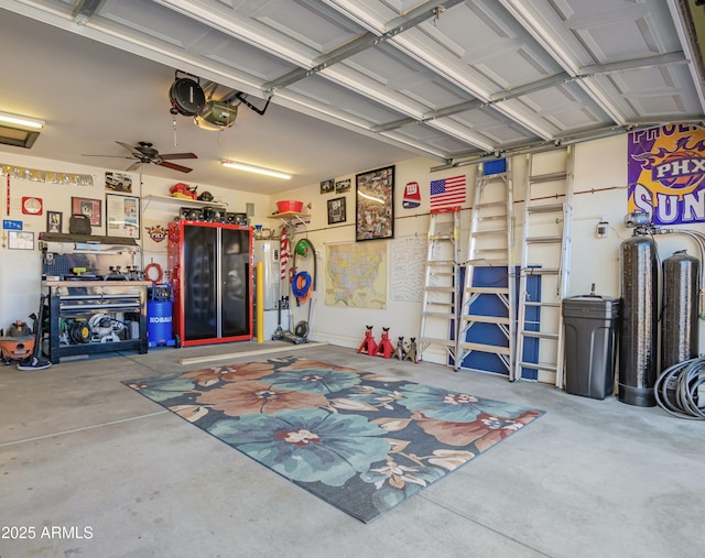 garage with water heater, ceiling fan, and a garage door opener