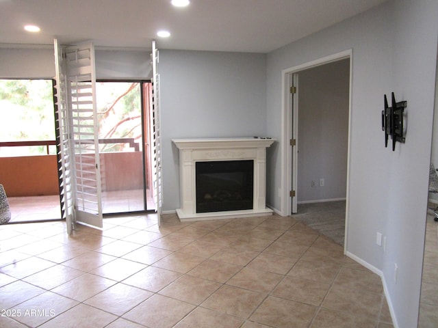 unfurnished living room featuring light tile patterned flooring