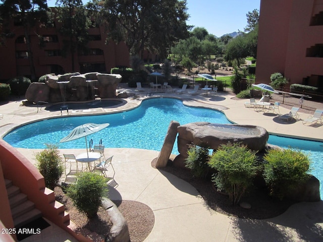 view of swimming pool featuring a patio area