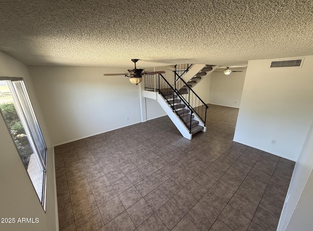 4849 W Northern Ave, Glendale, AZ 85301 - unfurnished room featuring ceiling fan, a textured ceiling, and stairs