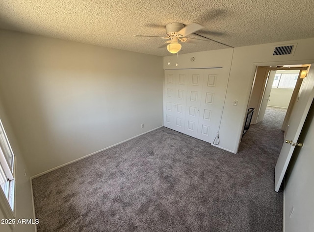 4849 W Northern Ave, Glendale, AZ 85301 - unfurnished bedroom featuring carpet flooring, a closet, a textured ceiling, and ceiling fan