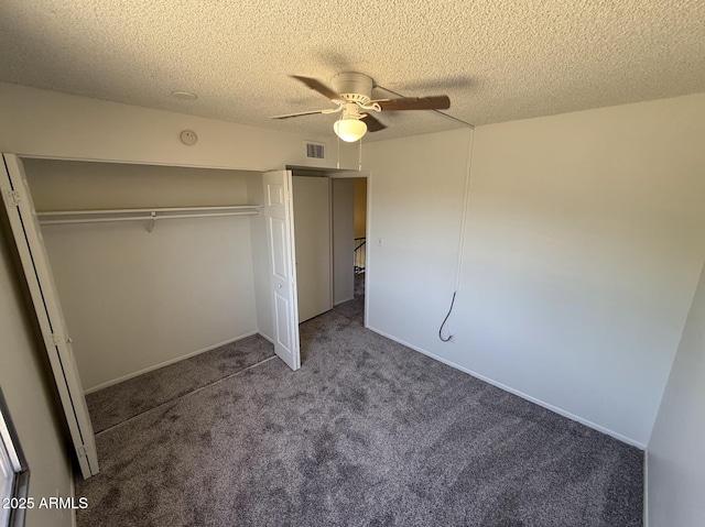 4849 W Northern Ave, Glendale, AZ 85301 - unfurnished bedroom featuring a closet, carpet floors, a textured ceiling, and a ceiling fan