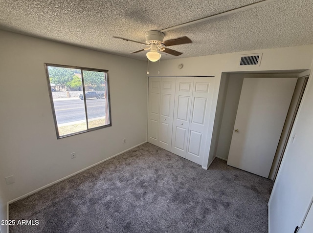 4849 W Northern Ave, Glendale, AZ 85301 - unfurnished bedroom with carpet flooring, a closet, a textured ceiling, and ceiling fan