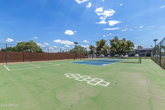 surrounding community featuring tennis court