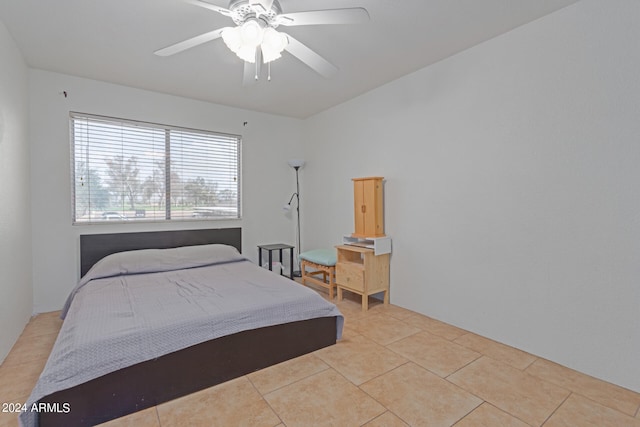 bedroom with ceiling fan and light tile patterned flooring