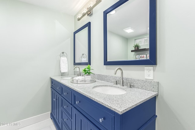 bathroom with vanity and tile patterned floors