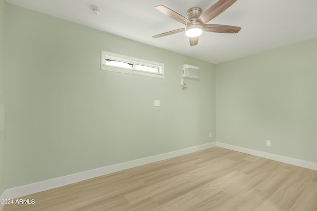 empty room featuring light wood-type flooring and ceiling fan