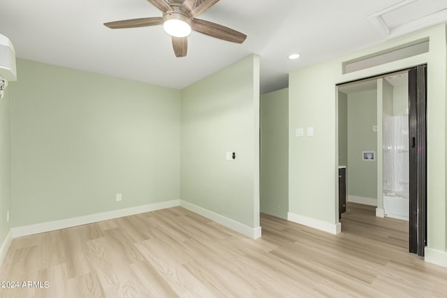 unfurnished room with ceiling fan and light wood-type flooring