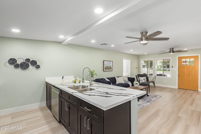 kitchen with dishwasher, light hardwood / wood-style flooring, light stone counters, sink, and ceiling fan