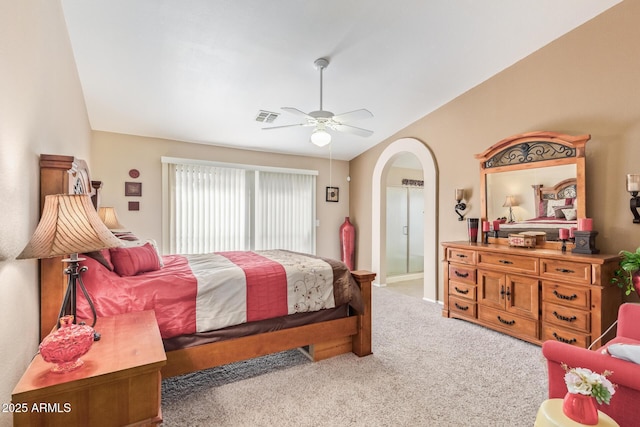 bedroom with vaulted ceiling, ceiling fan, and carpet flooring