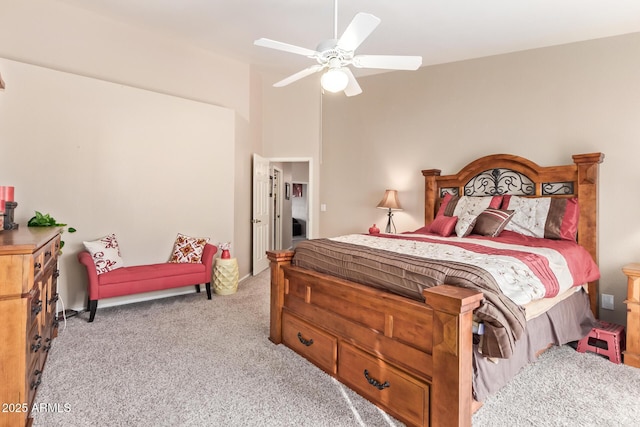 bedroom featuring light colored carpet and ceiling fan