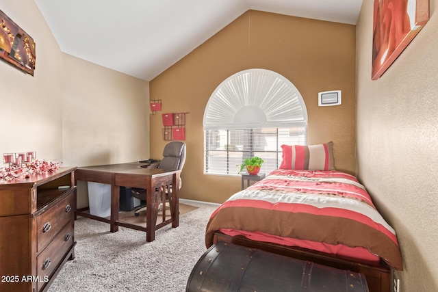 carpeted bedroom with vaulted ceiling