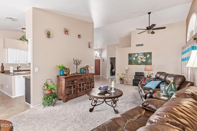 living room featuring high vaulted ceiling and ceiling fan