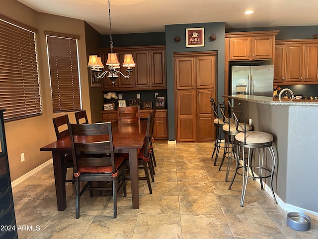 dining space featuring a notable chandelier