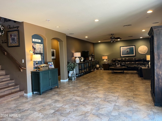 living room featuring ceiling fan