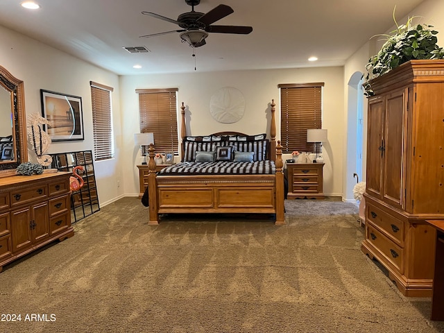 bedroom featuring dark colored carpet and ceiling fan