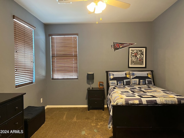 bedroom featuring ceiling fan and carpet