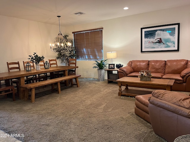 living room with carpet and a chandelier