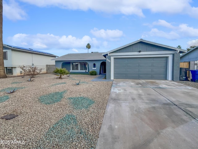 ranch-style house featuring a garage