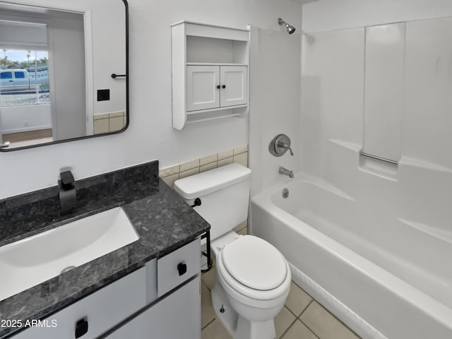 full bathroom with tile patterned flooring, vanity, shower / bathtub combination, and toilet