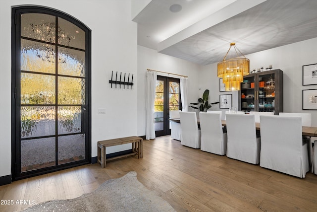 interior space with a notable chandelier and french doors