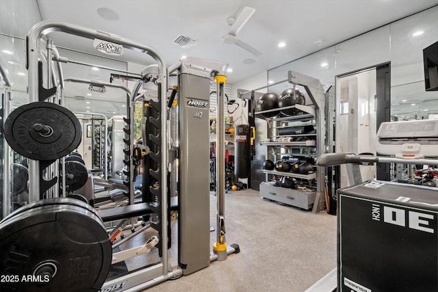 exercise room featuring light carpet, ceiling fan, and visible vents