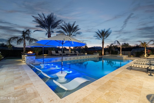 view of swimming pool featuring a patio area and a pool with connected hot tub