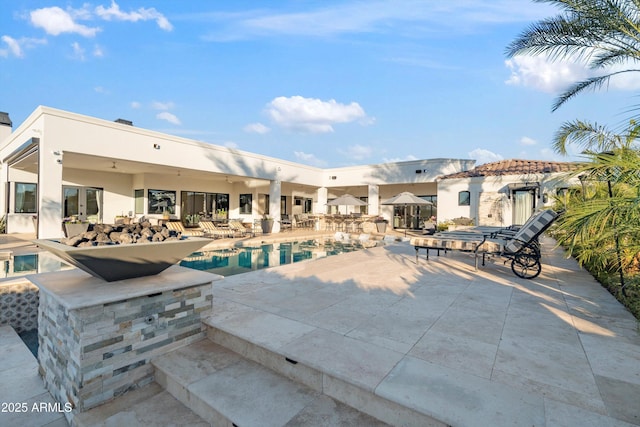 outdoor pool with a patio area