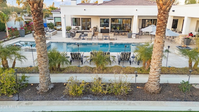 outdoor pool with a patio area