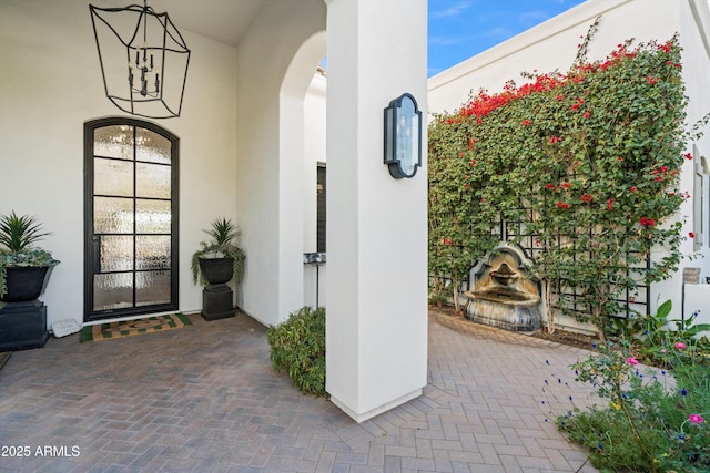 doorway to property with stucco siding