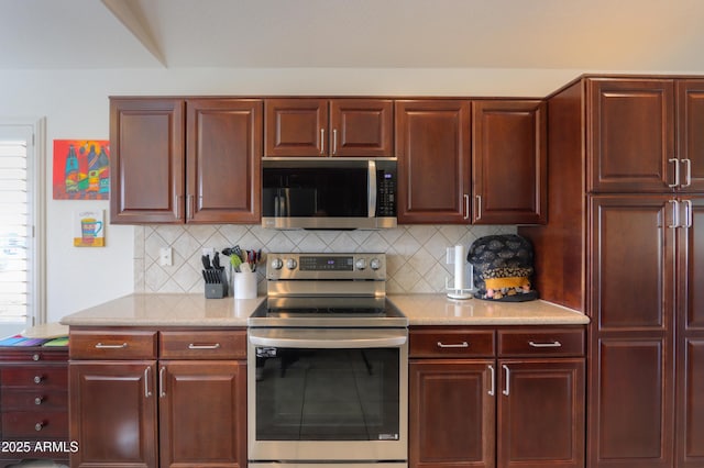 kitchen featuring tasteful backsplash and stainless steel appliances