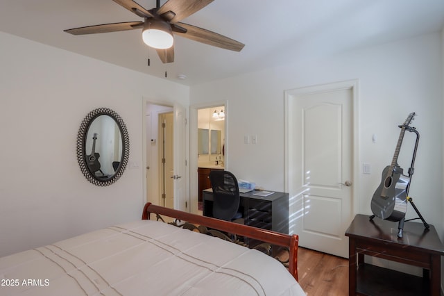 bedroom featuring hardwood / wood-style floors, ensuite bath, and ceiling fan