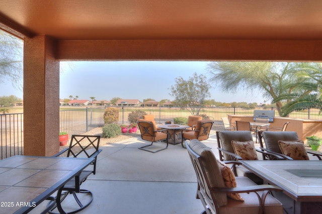 view of patio / terrace featuring a fire pit