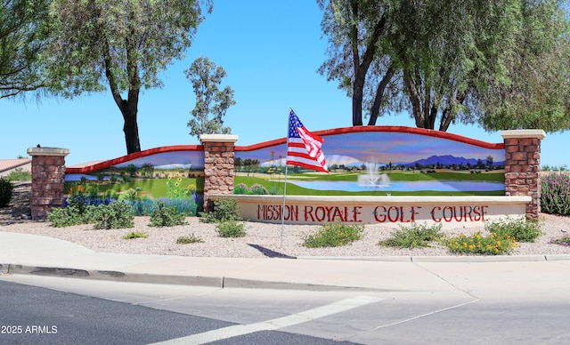 community / neighborhood sign featuring a water view