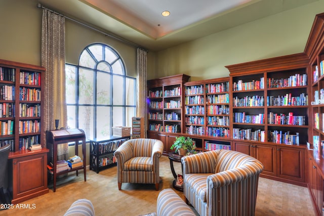 living area with light carpet