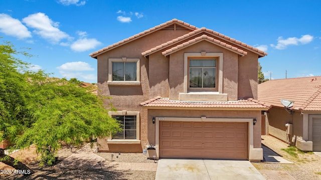 6712 W Northview Ave, Glendale, AZ 85303 - view of front facade with an attached garage, a tiled roof, driveway, and stucco siding