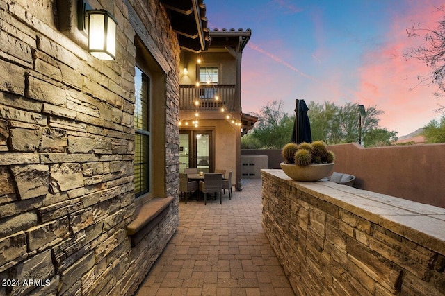 view of patio terrace at dusk