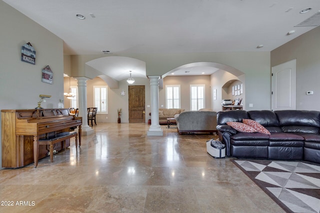 tiled living room featuring ornate columns