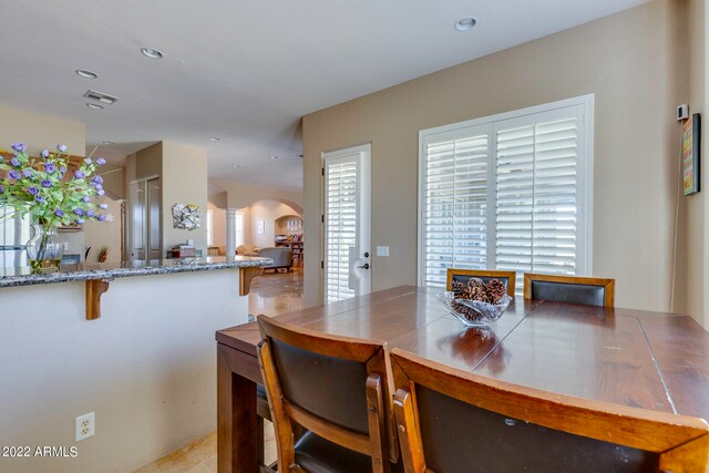 dining space with light tile flooring