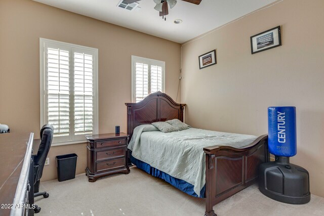 carpeted bedroom with ceiling fan