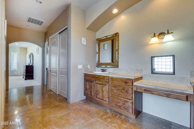 bathroom with tile floors and large vanity