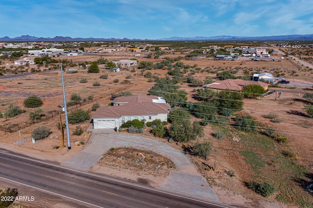 birds eye view of property featuring a mountain view