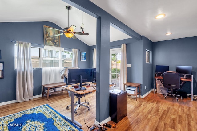 office with baseboards, ceiling fan, wood finished floors, and lofted ceiling
