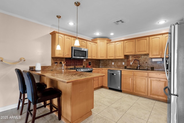 kitchen featuring visible vents, a peninsula, tasteful backsplash, and stainless steel appliances