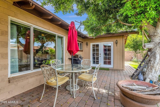 view of patio featuring french doors and outdoor dining space