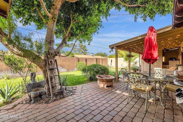 view of patio with fence and outdoor dining space