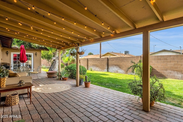 view of patio featuring area for grilling, a deck, and a fenced backyard